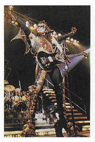 Kiss / Gene Simmons On Stage, Arms Outstretched | Magazine Photo