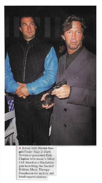 Clapton, Eric / With Steven Seagal and Silver Clef Award | Magazine Photo | December 1995