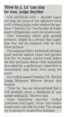 Lopez, Jennifer / Glow by J. Lo Can Stay for Now, Judge Decides | Newspaper Article | December 2002