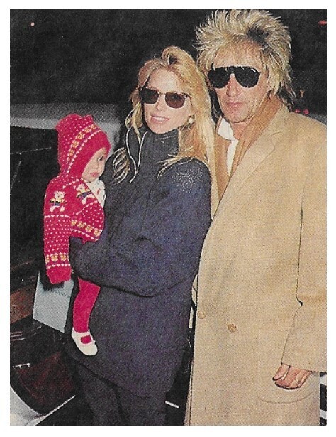 Stewart, Rod / With Kelly Emberg and Baby-In Tan Coat | Magazine Photo | 1987