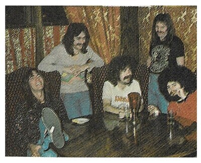 Boston / Group Gathered Around Table-Tom Laughing | Magazine Photo | 1977