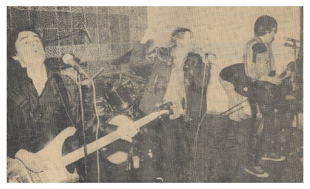 Sex Pistols, The / On Stage-Johnny Rotten in Center / 1976