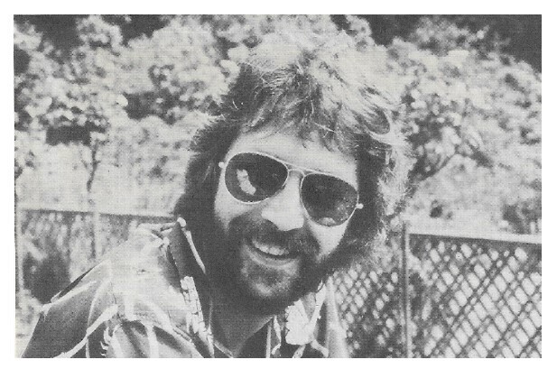 Clapton, Eric / Outdoors Near Fence-Smiling | 1978