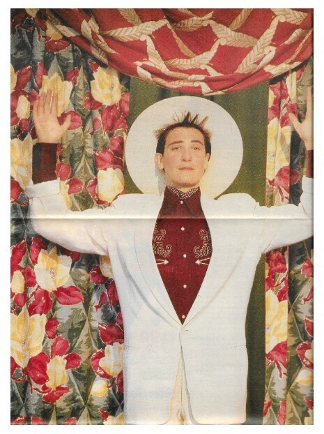 Lang, K.D. / In White Suit-Large White Hat-Arms Up | 1988
