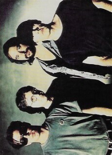 R.E.M. / 1992: Group Photo, Michael On Right, Green Background
