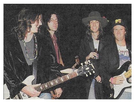 Black Crowes, The / Chris Robinson 2nd from Right-Holding Bottle / 1992