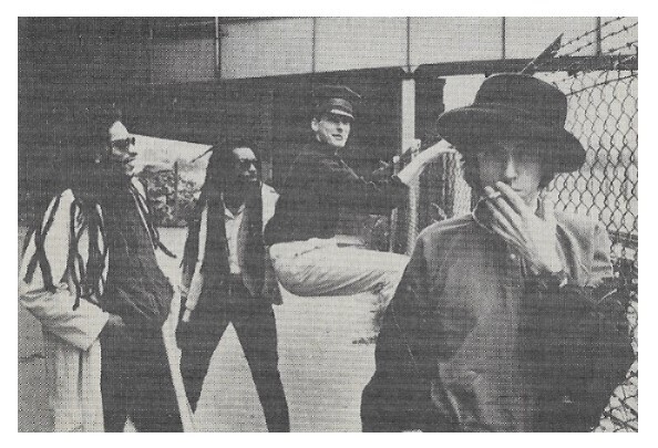 Big Audio Dynamite / Group Near Chain Link Fence / 1984