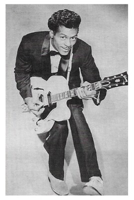 Berry, Chuck / Playing Guitar - Black Suit - Bow Tie / 1958