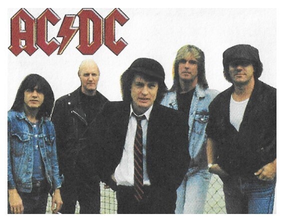 AC/DC / 1990: Group Standing - Angus in Center - Name at Upper Left