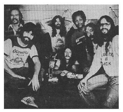 Doobie Brothers, The / Group Photo - Michael Wearing Olympia Beer Shirt / 1976