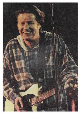 Henley, Don / On Stage-Plaid Shirt-Smiling-with Guitar (1993)