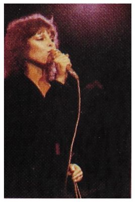 Benatar, Pat / On Stage-Holding Mic.-Dark Background (1980s)