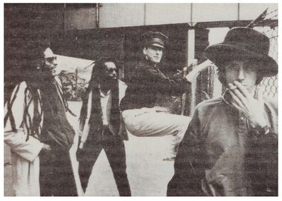 Big Audio Dynamite / Group Near Chain Link Fence (1984)