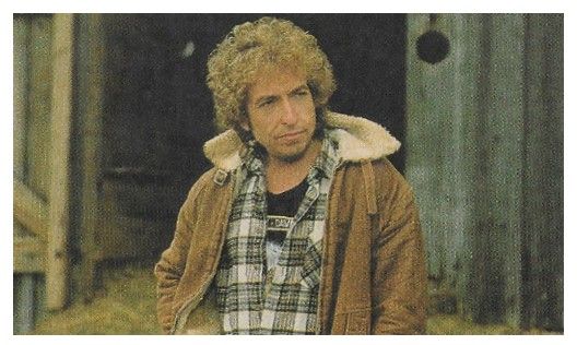 Dylan, Bob / Standing-Brown Coat-Plaid Shirt (1987)