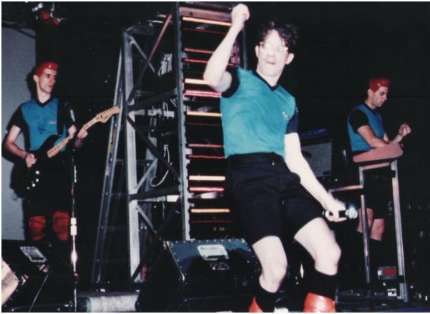 Devo / On Stage, Mark in Center, Blue-Black Shirts | Photo Print (1981)