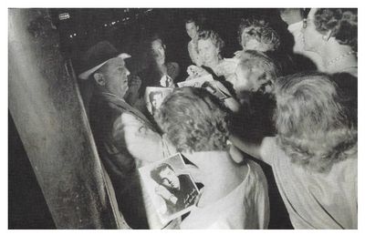 Parker, Colonel Tom / Handing Out Elvis Photos / 1956