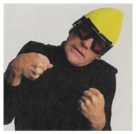 Frey, Glenn / Black Jacket-Yellow Cap-Goggles / 1988
