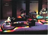 John, Elton / On Stage, Rainbow Theatre, Ray Cooper at Right | Magazine Photo (1977)