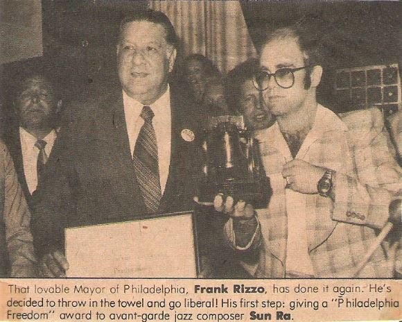 John, Elton / With Frank Rizzo, Receiving Award | Magazine Photo with Caption (1976)