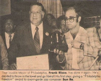 John, Elton / With Frank Rizzo, Receiving Award | Magazine Photo with Caption (1976)
