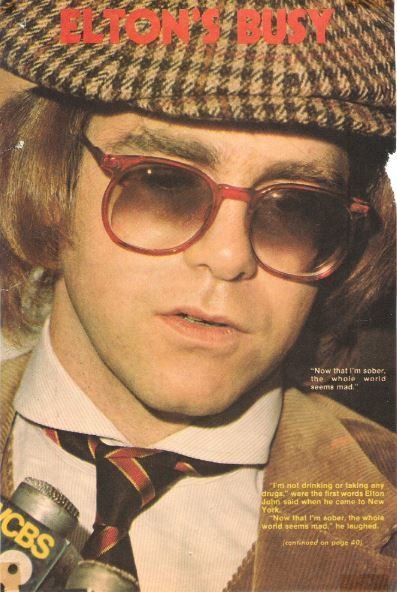 John, Elton / Elton's Busy | Magazine Article with 2 Photos (1977)
