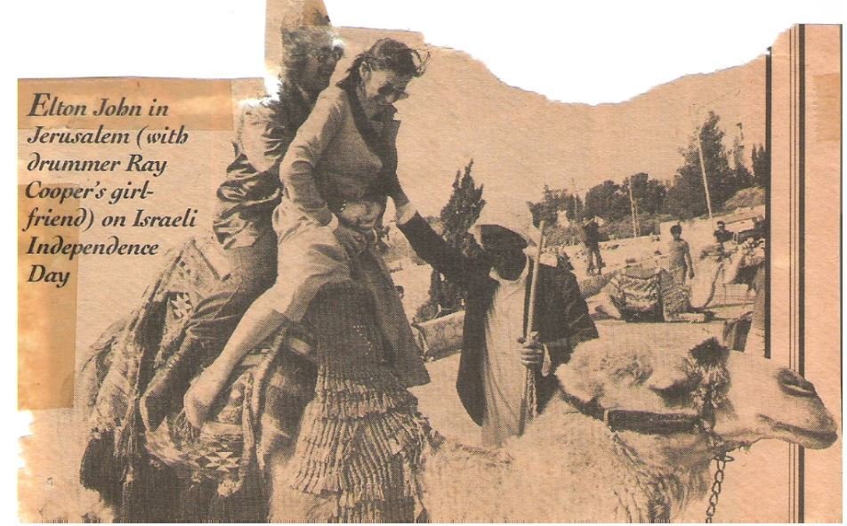 John, Elton / Riding a Camel in Jerusalem | Magazine Photo with Caption (1979)