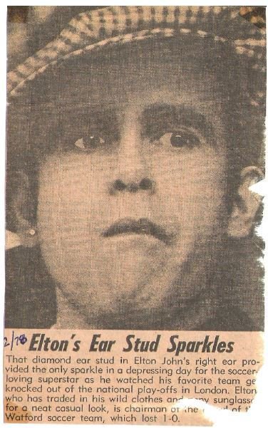 John, Elton / At Soccer Game, Checked Hat #1 | Newspaper Photo with Caption (1978)
