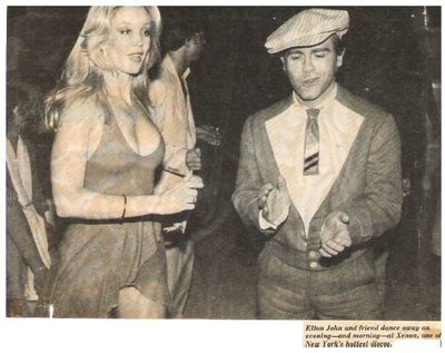 John, Elton / With Cheryl Rixon at Xenon Disco, NYC | Magazine Photo with Caption (1978)