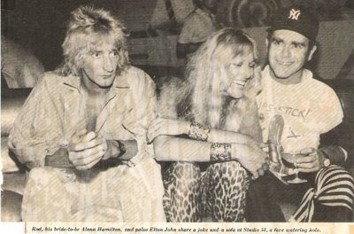 John, Elton / With Rod Stewart + Alana Hamilton at Studio 54 | Magazine Photo with Caption (1978)