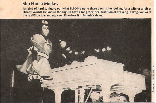 John, Elton / Slip Him a Mickey | Magazine Photo with Caption (1980)