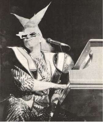 John, Elton / On Stage - Twisted Wig - Funny Face | Magazine Photo (1986)