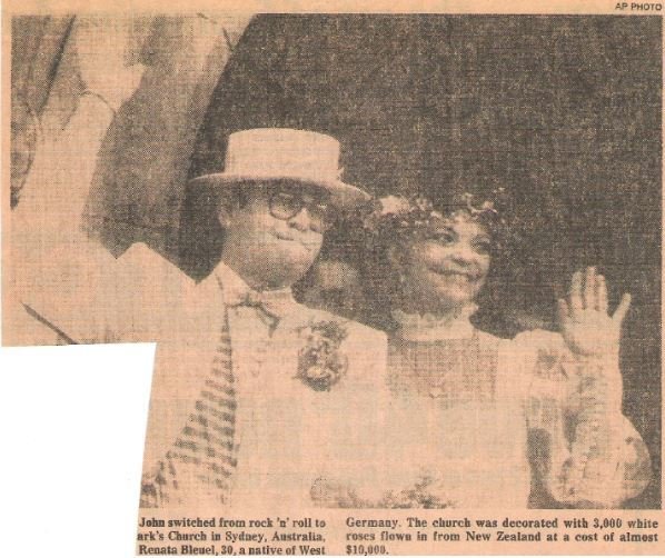 John, Elton / At Wedding, with Renate Blauel, Waving | Newspaper Photo with Caption (1984)