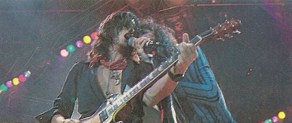 Aerosmith / Joe + Steven On Stage, Singing Into Mic. | Magazine Photo (1978)