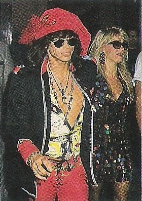 Aerosmith / Steven Tyler with Wife Teresa, Steven in Red Hat and Pants | Magazine Photo (1990)