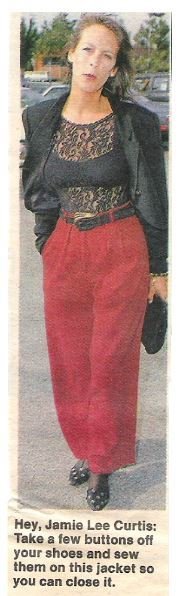 Curtis, Jamie Lee / Red Pants, Black Jacket | Magazine Photo with Caption | 1990