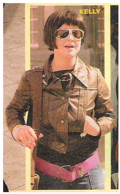 Osbourne, Kelly / Leather Jacket, Sunglasses, Purple Belt | Magazine Photo | 2002