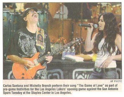 Santana, Carlos / Pre-Game Festivities - Lakers vs. Spurs | Newspaper Photo with Caption | October 2002 | with Michelle Branch