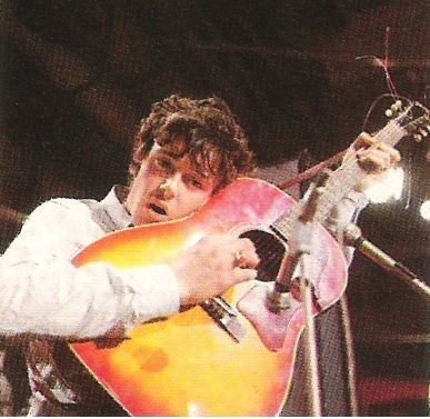 Donovan / On Stage with Red-Orange Guitar, White Shirt | Magazine Photo | 1960s