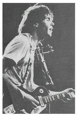 Young, Neil / On Stage-Profile-Eyes Closed-Guitar / 1970s