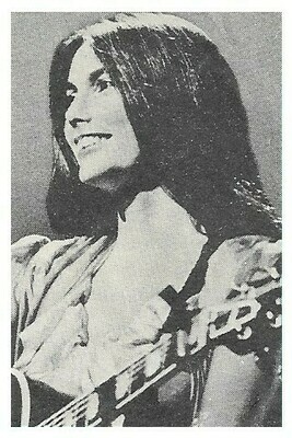 Harris, Emmylou / On Stage, Smiling, Profile, with Guitar / 1970s
