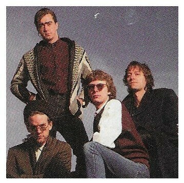 R.E.M. / Group Photo-Outdoors-Michael Stipe at Lower Left / 1989