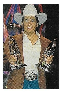 Strait, George / Holding 2 Awards at CMA Awards / 1997