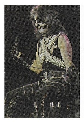 Kiss / Peter Criss On Stage, Sitting, Holding Mic.