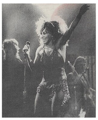 Turner, Tina / On Stage-Smiling-Left Arm Raised / 1980s