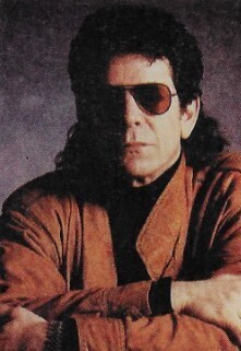 Reed, Lou / In Brown Jacket, Sunglasses, Grey Background / 1988