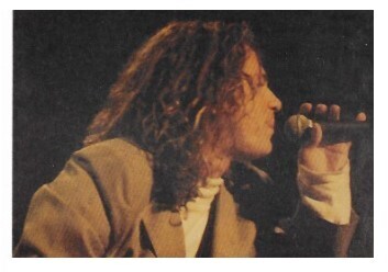 INXS / Michael Hutchence On Stage, Profile, Brown Jacket / 1988
