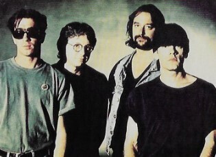 R.E.M. / Group Photo, Michael On Right, Green Background / 1992