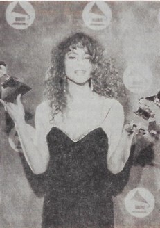 Carey, Mariah / At Grammys, Holding 2 Awards, in New York / 1991