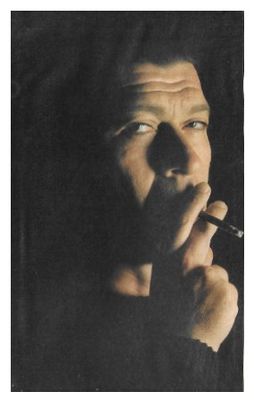Robertson, Robbie / Closeup--Smoking--Black Background / 1987