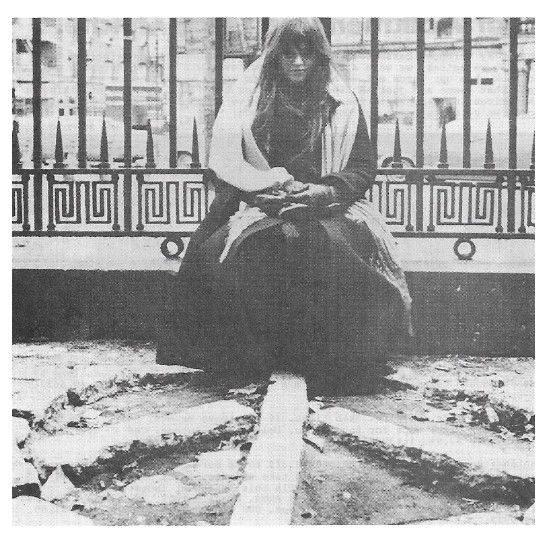 Melanie / Outside--Sitting in Front of Wrought Iron Fence